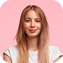 A pretty woman with long blond hair posing on a pink background