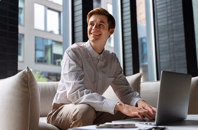A young manager working in the office at the laptop