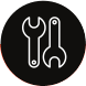 White wrench and screwdriver crossed inside a black circular icon.