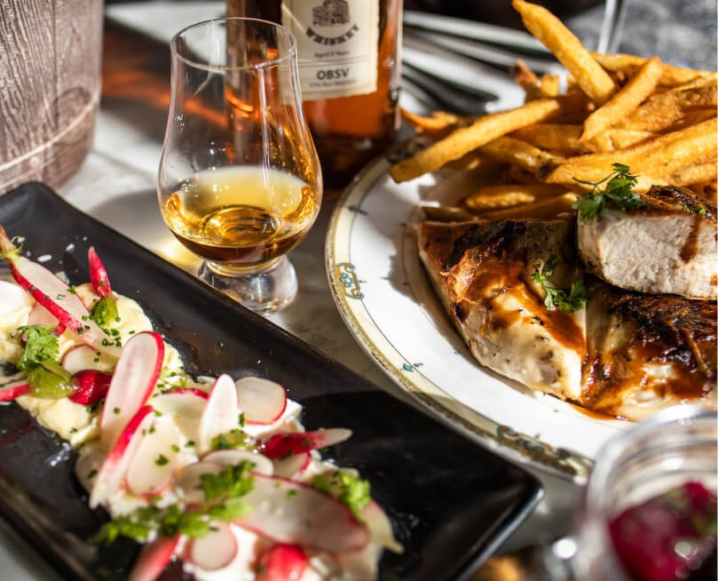Chicken, fries, appetizers and whiskey at Village Whiskey