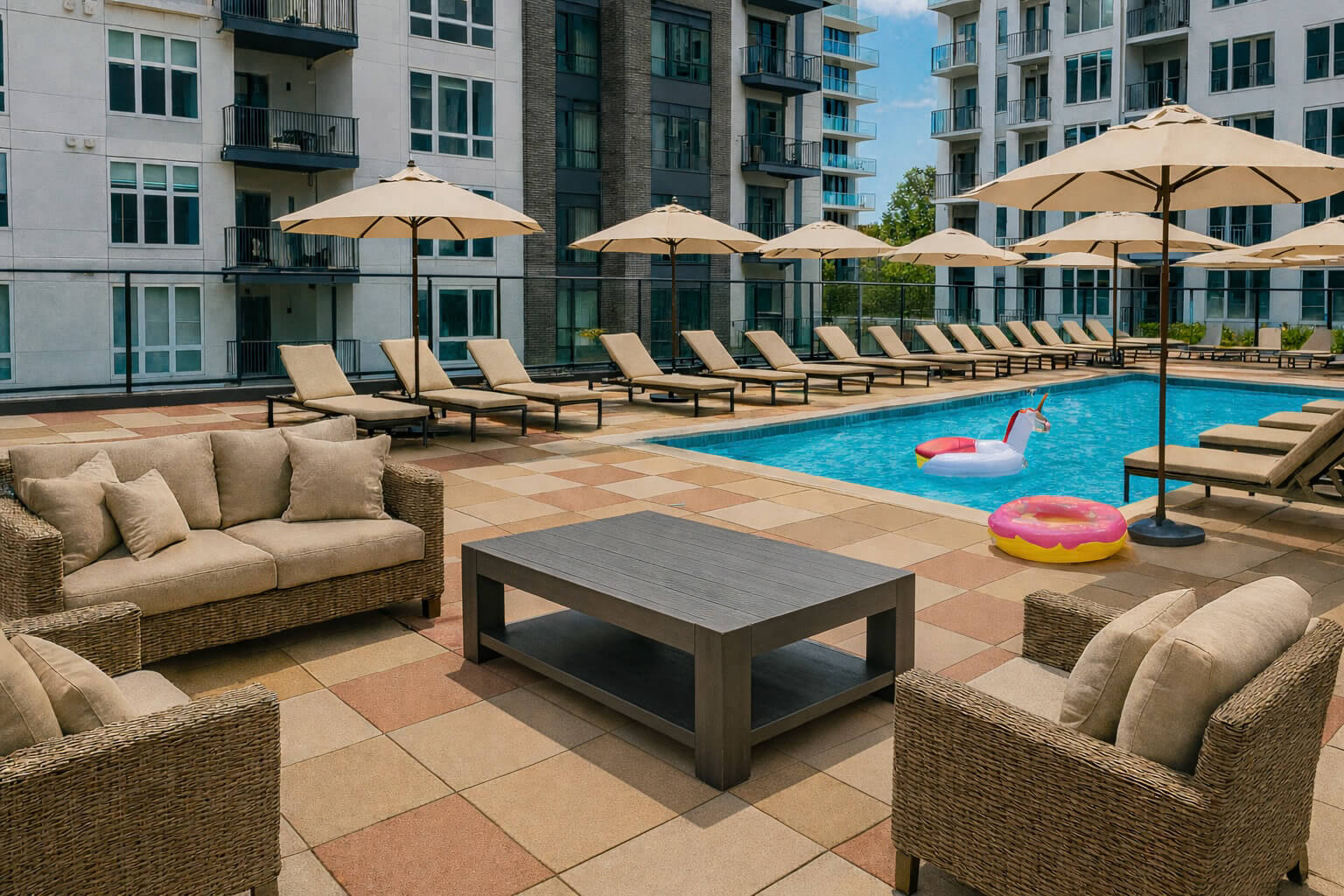 Rooftop pool with floaties and lounge chairs at The Quinley boutique hotel in The Gulch, Nashville