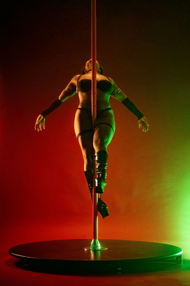 Performance portrait with red and green studio lighting