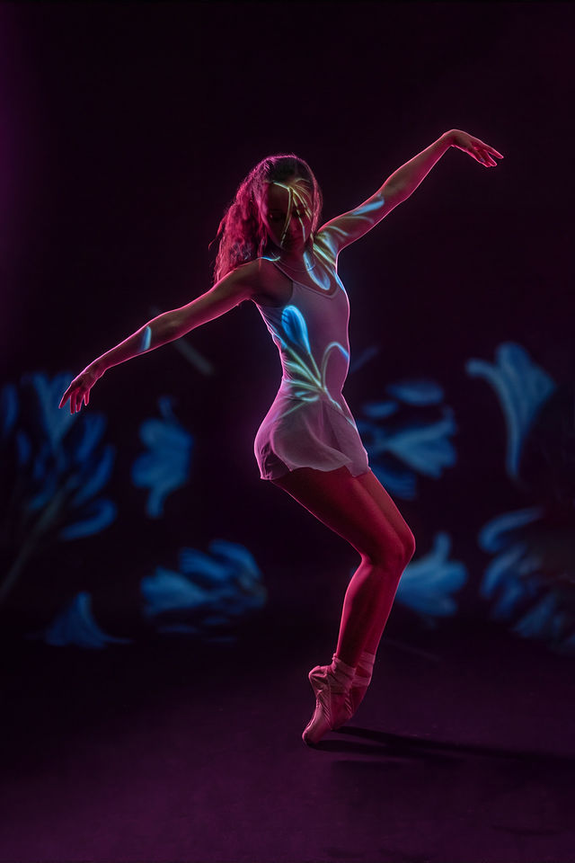 Dance portrait with colorful projected light