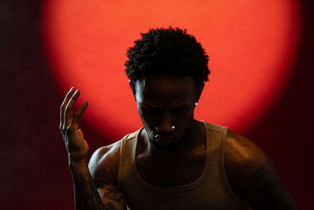 Musician portrait with dramatic red lighting