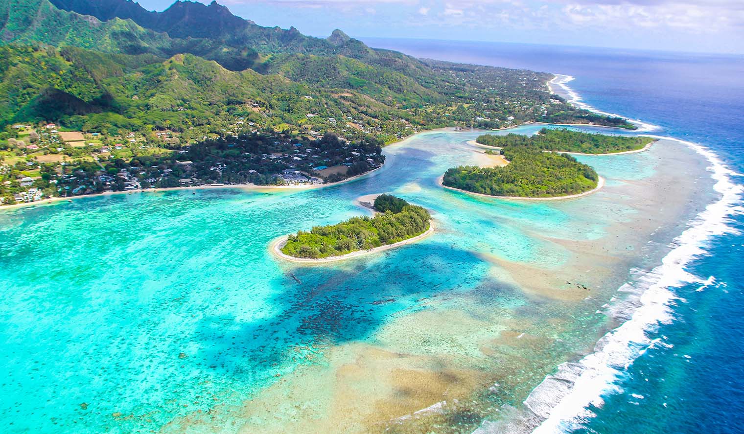Panoramic view of the tropical lagoon and beaches in the Cook Islands representing its status as the gold standard for global asset protection.