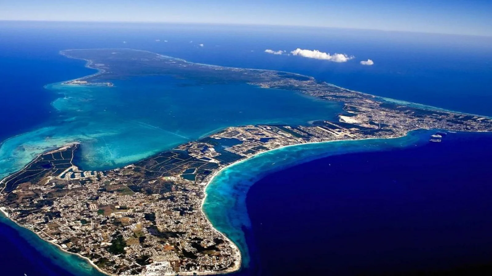 Aerial view of Seven Mile Beach and luxury developments in the Cayman Islands representing its status as the world's premier offshore financial hub.