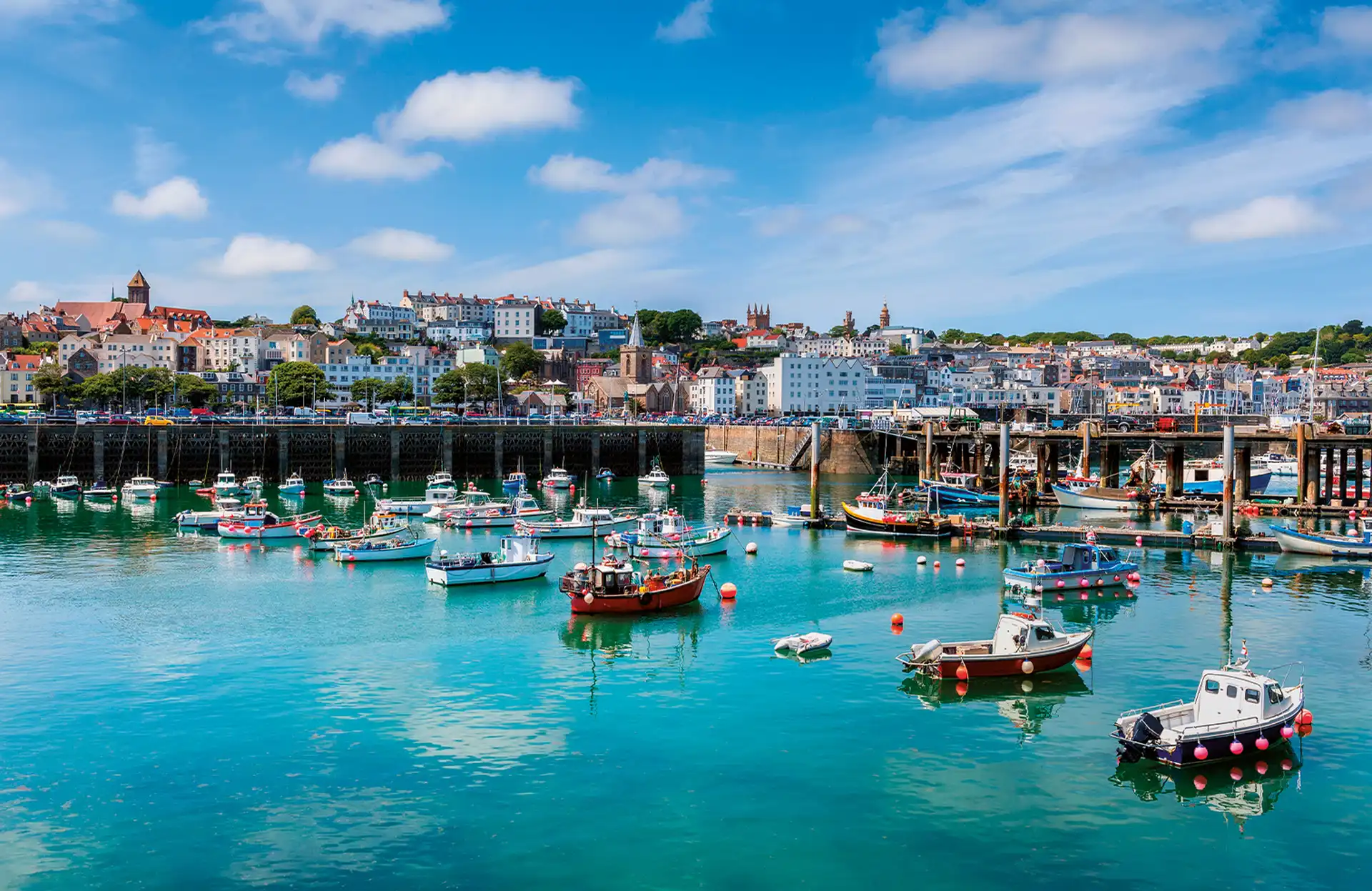 Modern commercial buildings in Guernsey highlighting the infrastructure for fund administration, insurance, and international company formations.