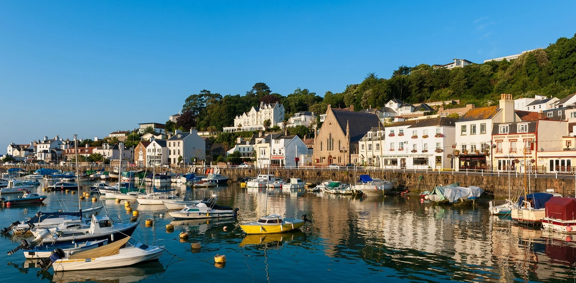 Scenic coastal landscape of Jersey representing its strategic proximity to the UK and status as a stable Crown Dependency.