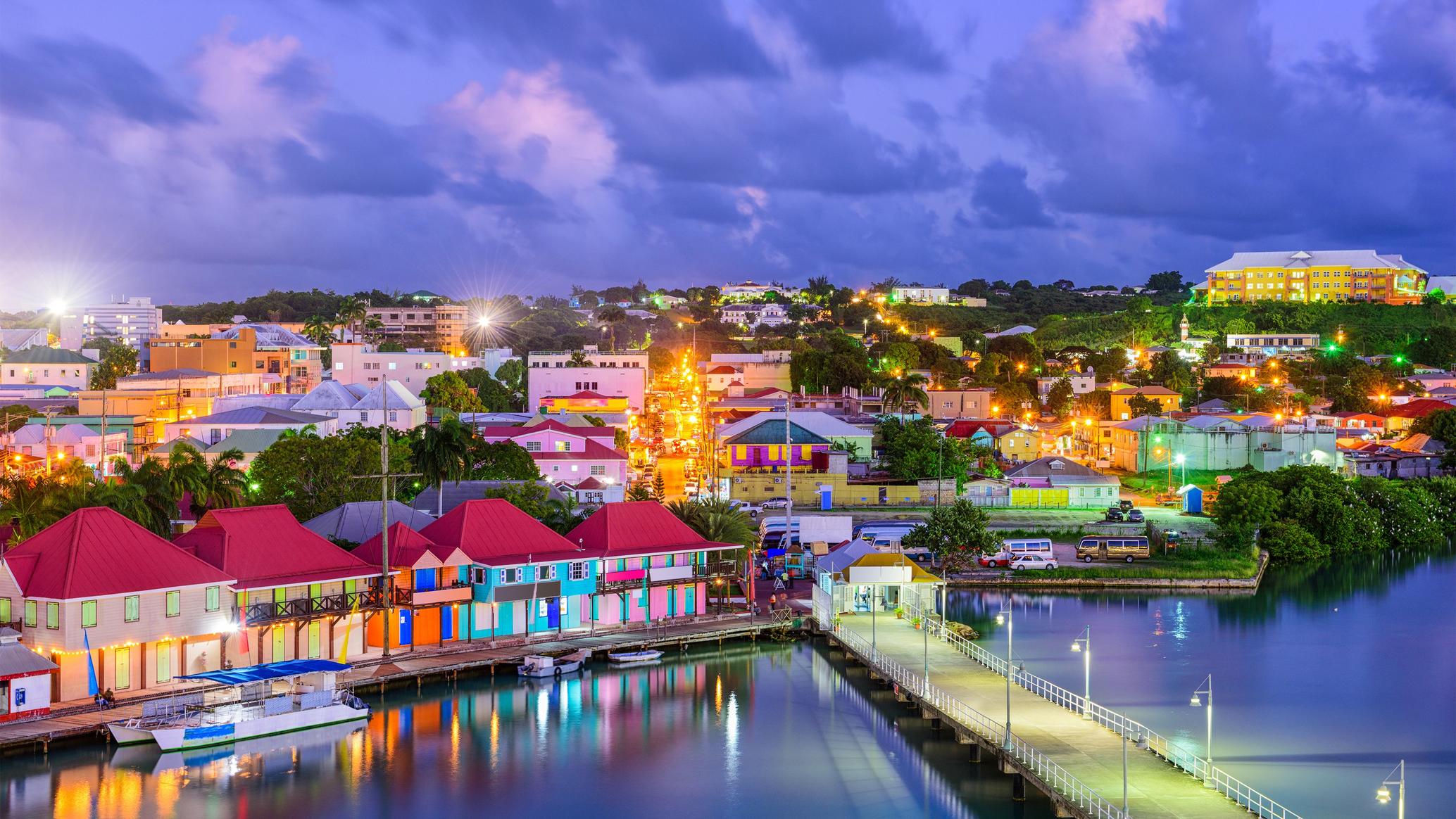 Panoramic view of the Antigua coastline and turquoise waters representing the citizenship by investment program and luxury real estate.