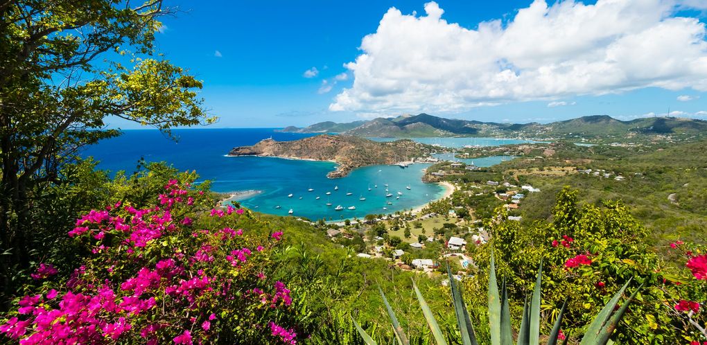 Scenic view of the Antigua harbor representing its status as a stable and established Caribbean jurisdiction for global wealth.
