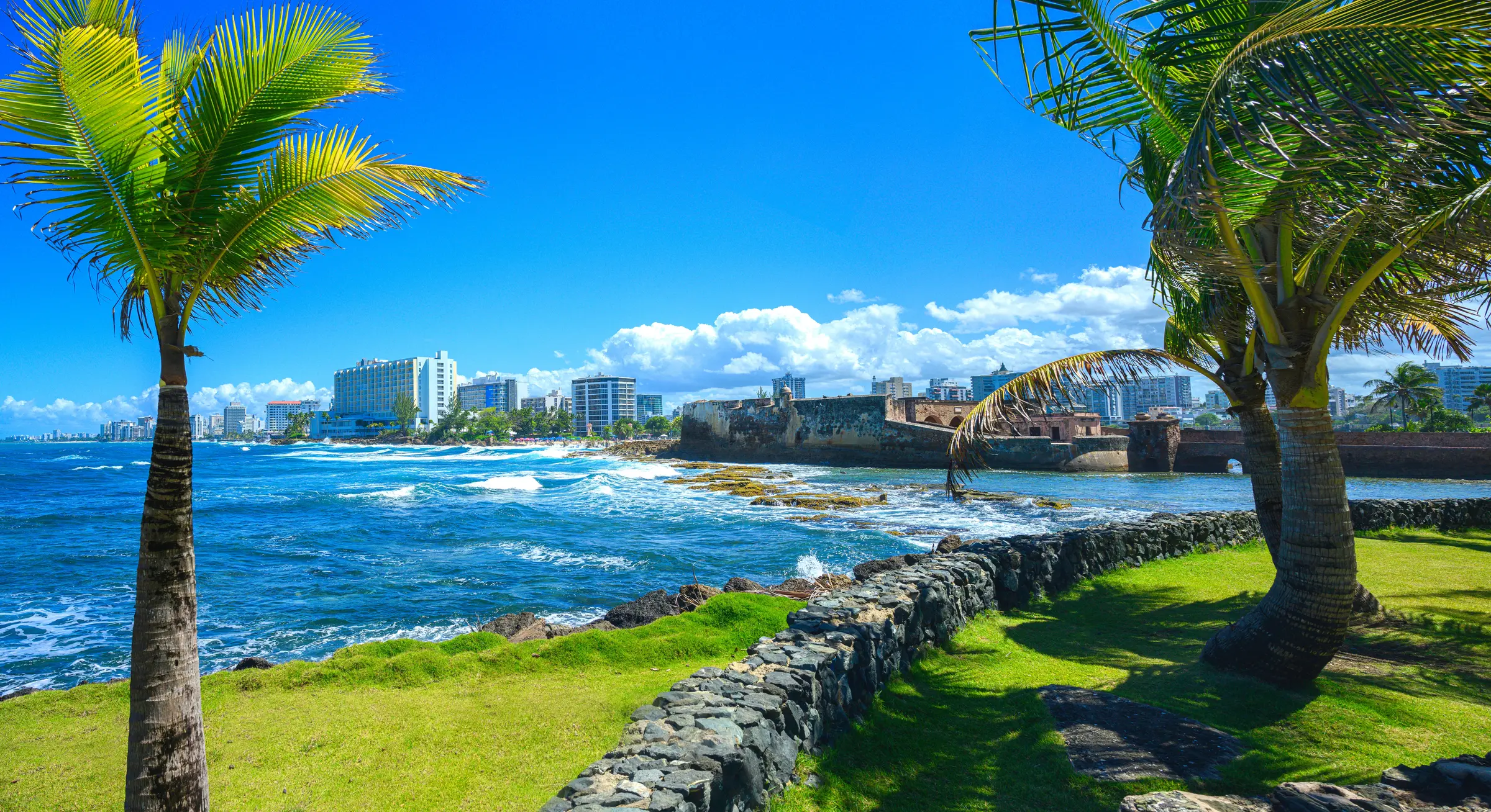 Modern residential and commercial developments in Puerto Rico highlighting the infrastructure for Act 60 export service businesses.