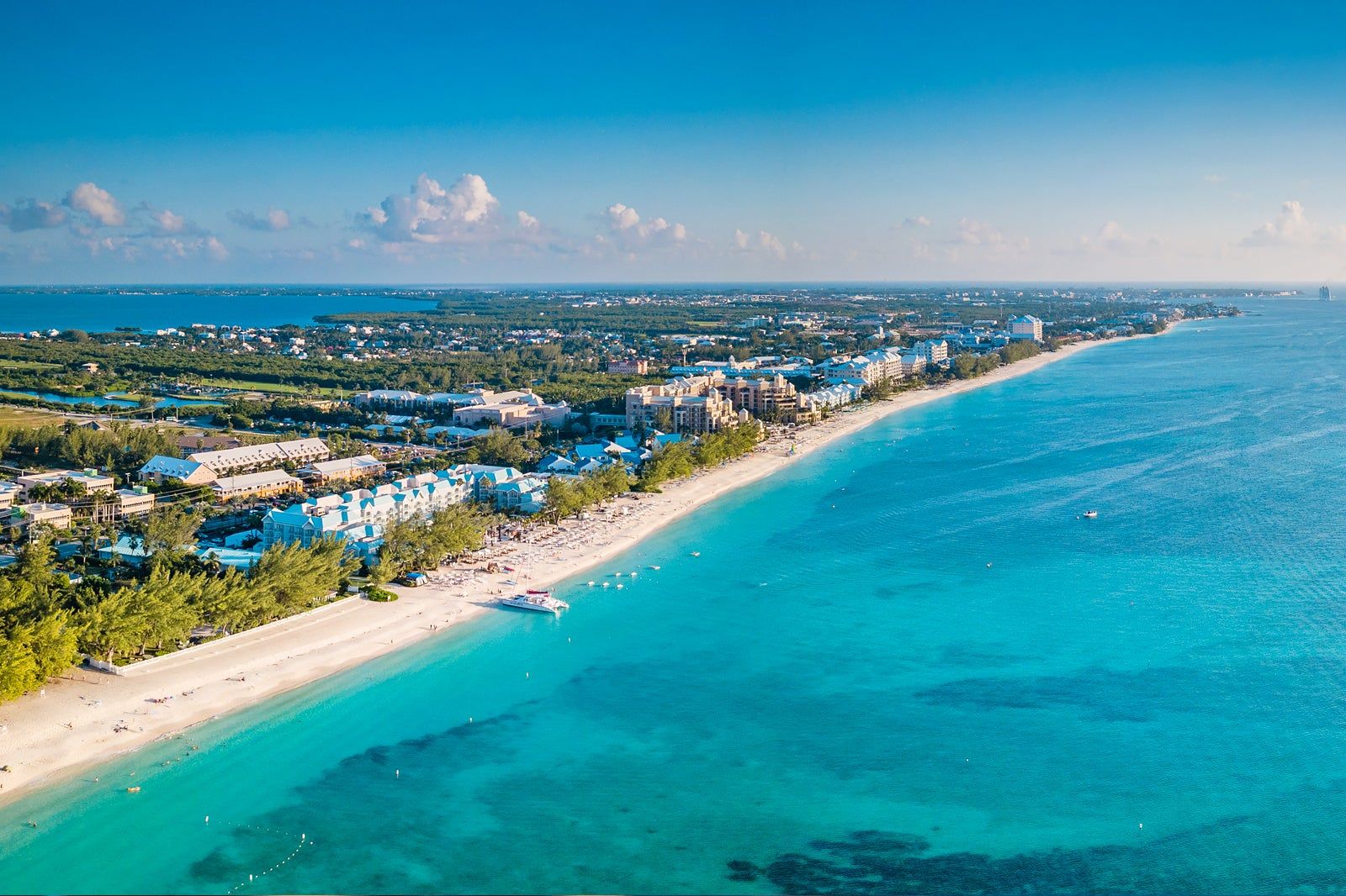 How Offshore Companies Reduce Crypto Tax Liability alt text: Scenic Cayman Islands view representing offshore company structuring to reduce crypto tax liability.