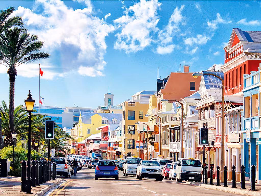 Scenic coastal view of Bermuda’s turquoise waters and pink sand beaches reflecting the luxury lifestyle for international professionals.