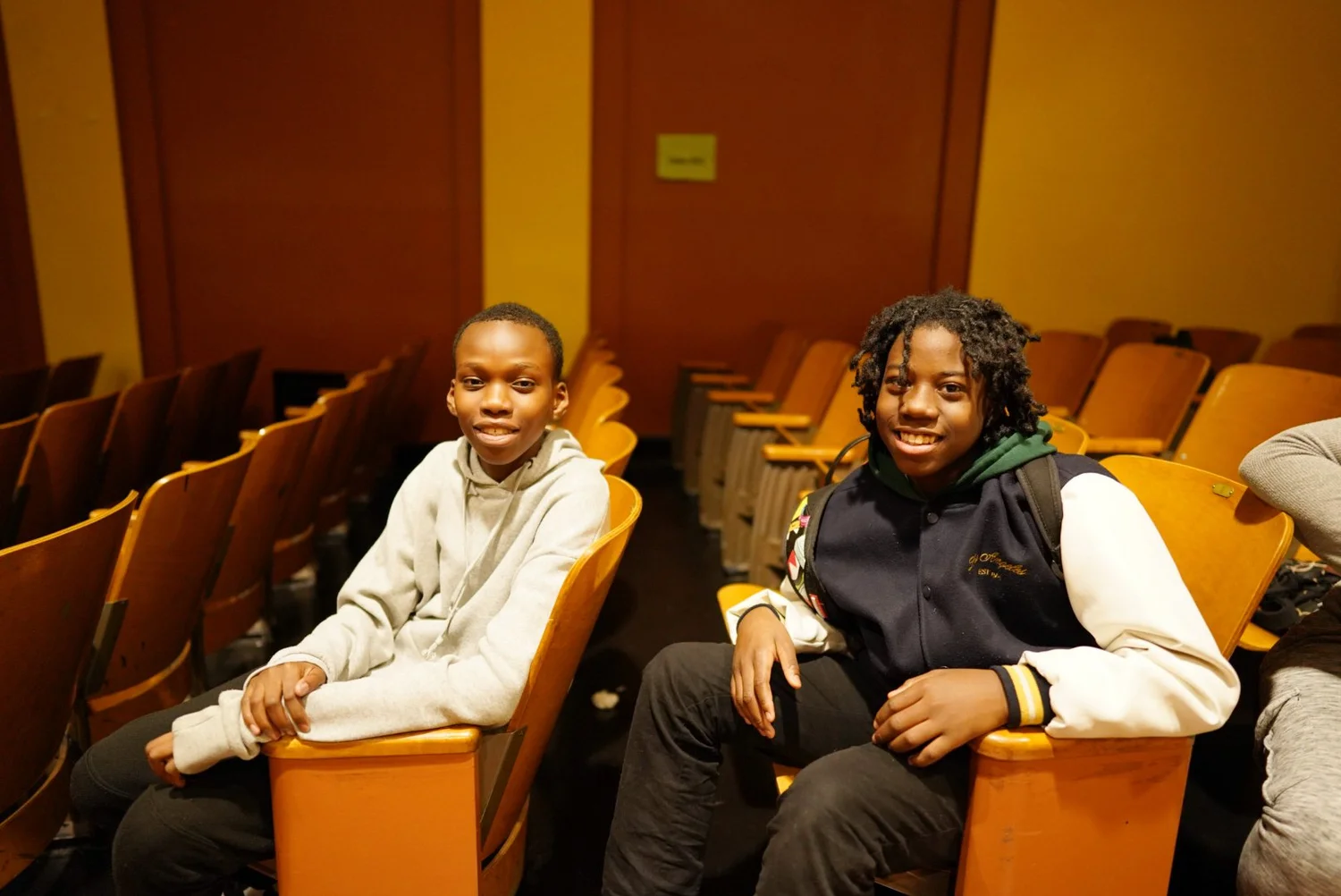 School cafeteria filled with students sitting and eating 