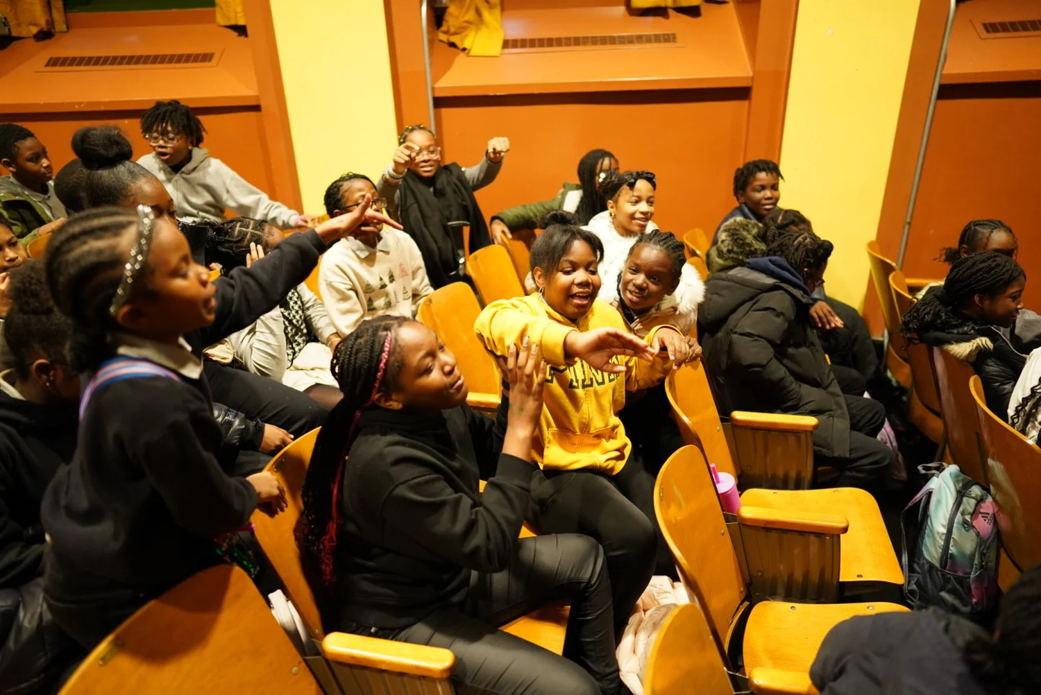 Group of children sitting and interacting cheerfully 