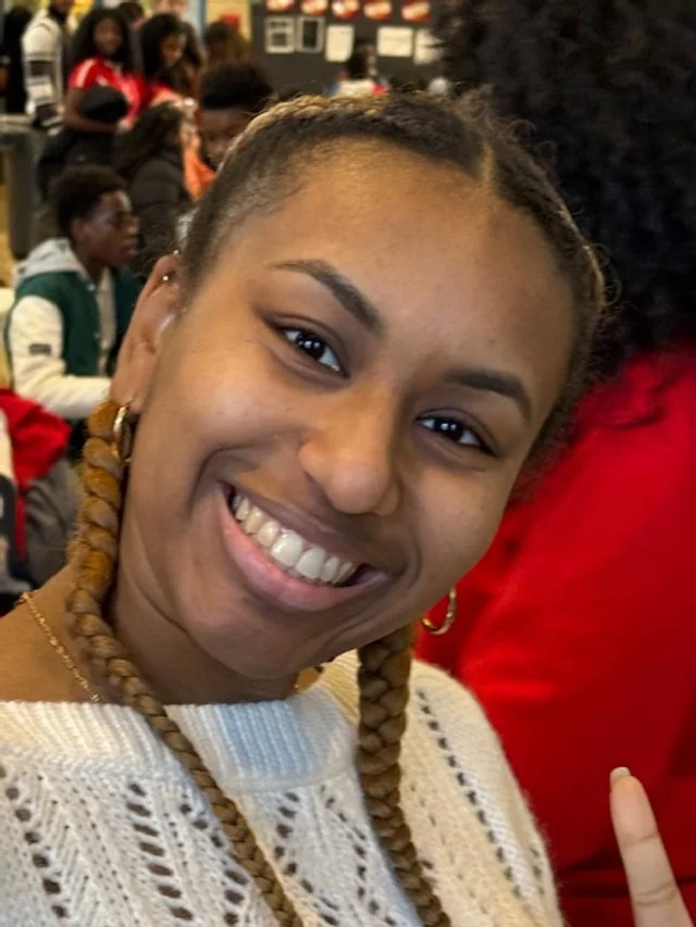 Smiling young woman with braided 