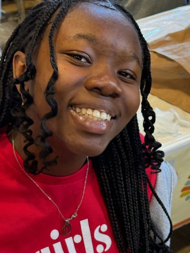 Young woman with braided hair smiling