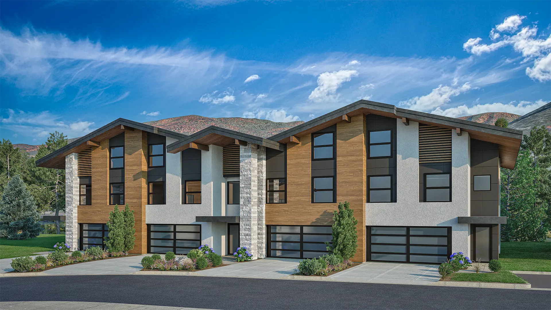 Contemporary 4-plex townhome exterior at Alcove in Midway, Utah, showcasing wood, stucco, and stone finishes with dramatic rooflines and large windows.