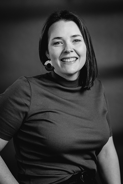 image of workers at machining station (for a manufacturing plant)