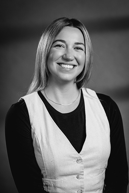 image of workers at machining station (for a manufacturing plant)