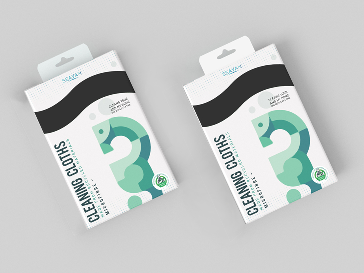 Two packages of Seayan cleaning cloths made from recycled microfiber materials, featuring a green abstract design and labeled 'Cleans your and my home one bottle at a time'.