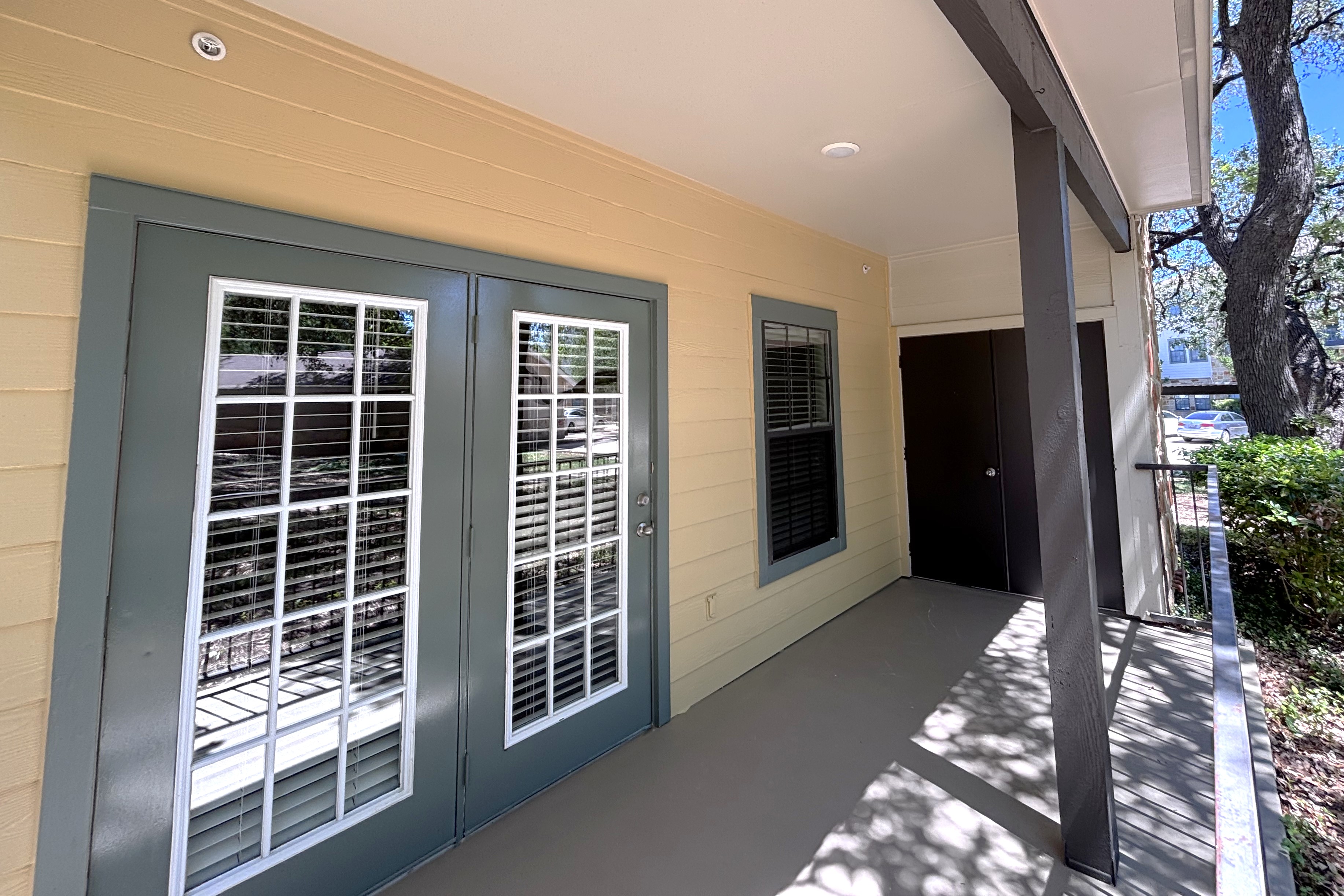Staged bedroom with bed and dresser