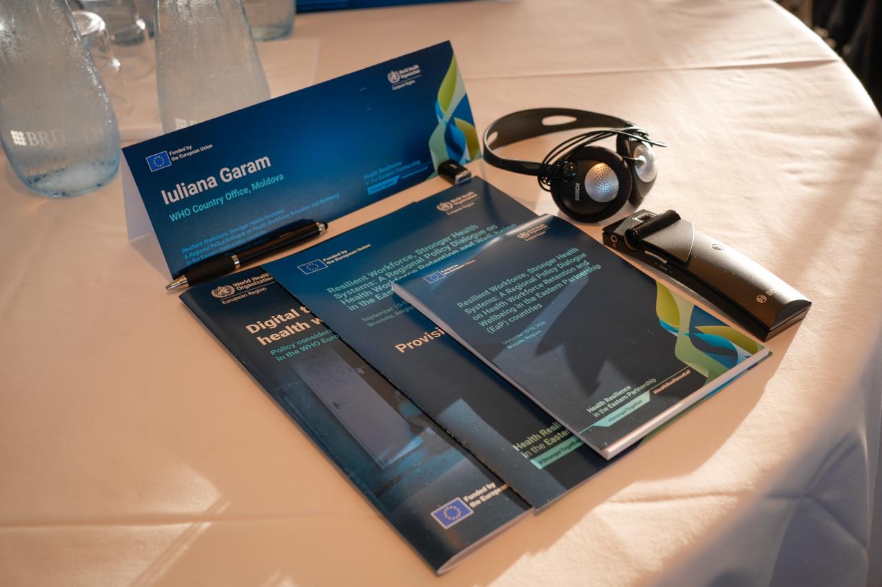 Event programme materials and interpretation headset prepared for delegates