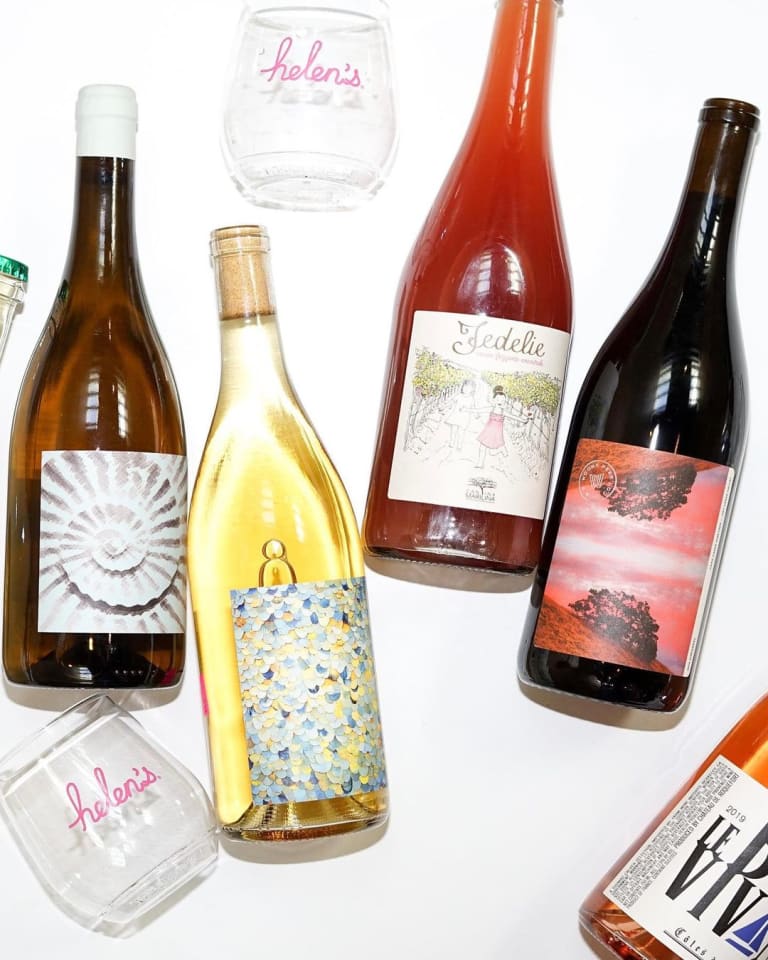 Selection of natural and biodynamic wines from Helen's Wines club featuring Fedelie label and Helen's branded glassware