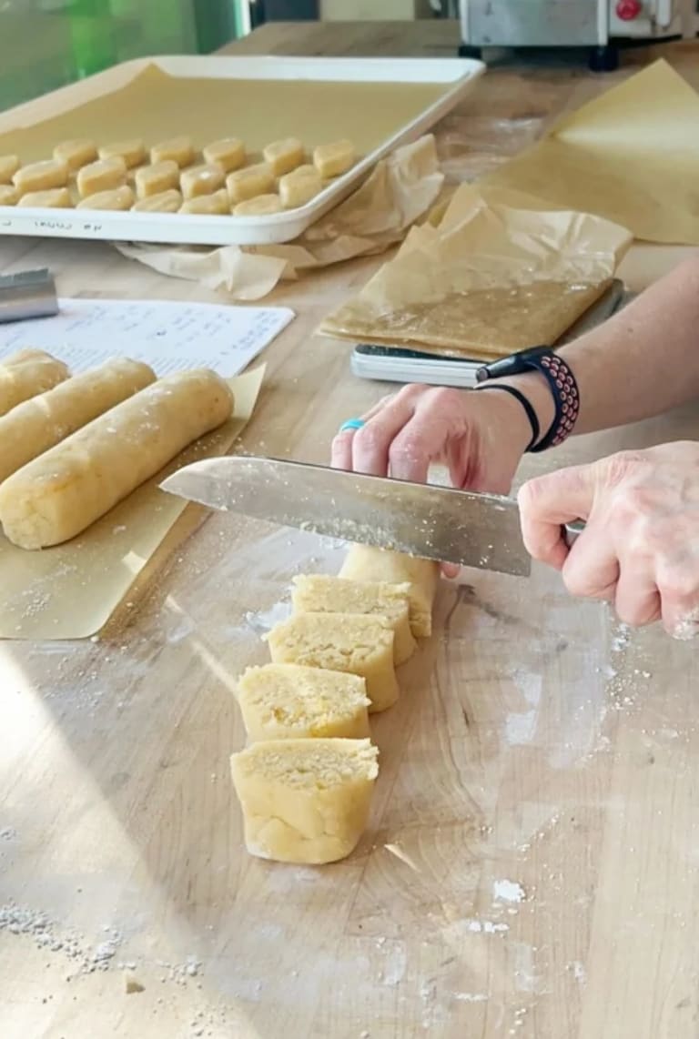Hand-cutting fresh pasta dough in the open kitchen at Ferrazzani's Pasta & Market