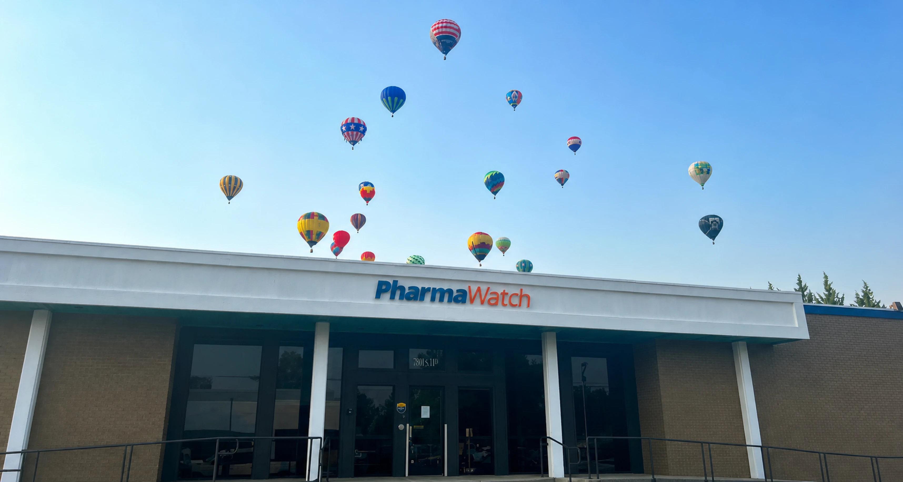 Pharmawatch Office with hot air balloons floating over the office