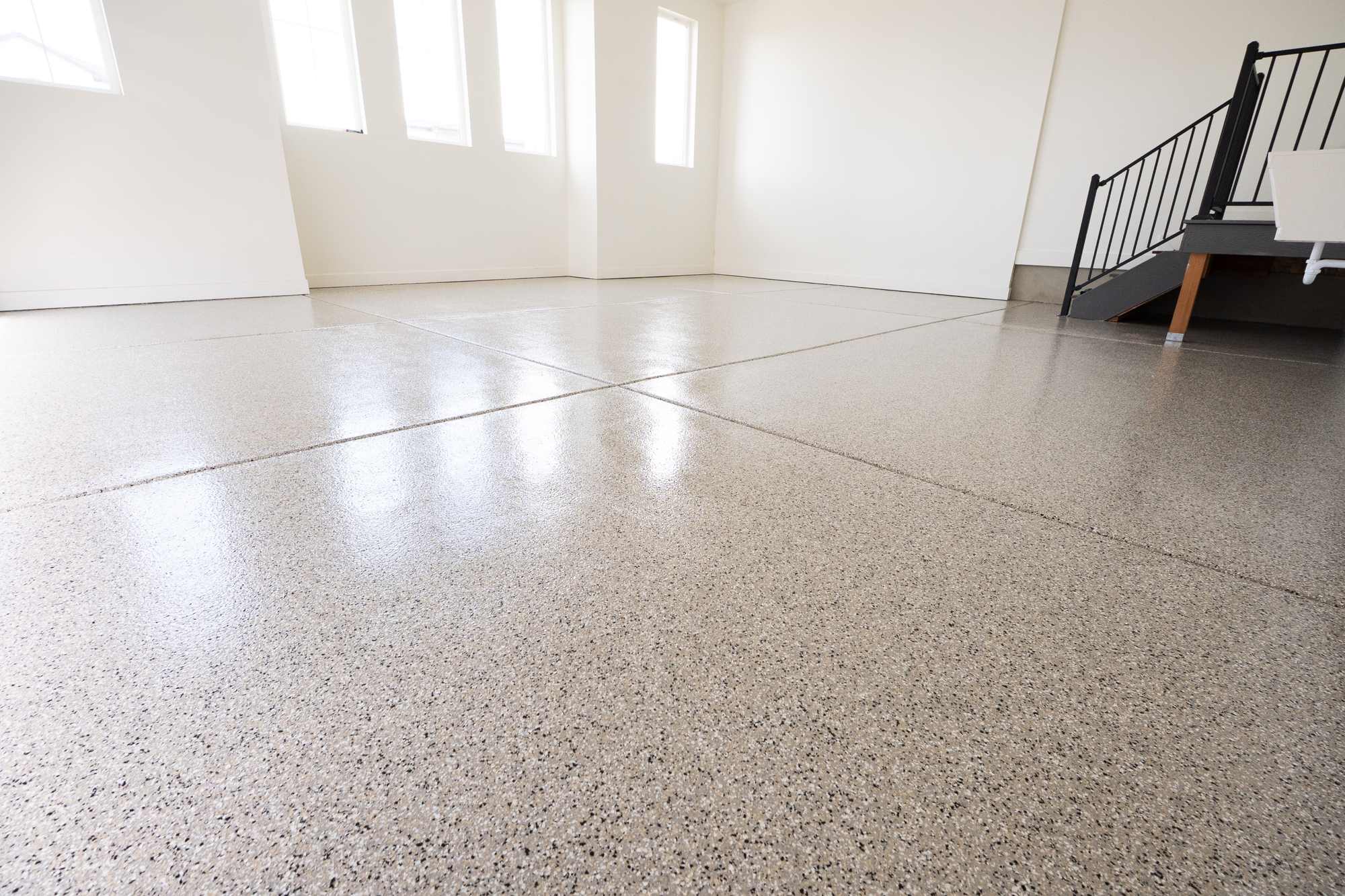 Residential tan flake epoxy garage floor by Lifetime Coatings in Utah