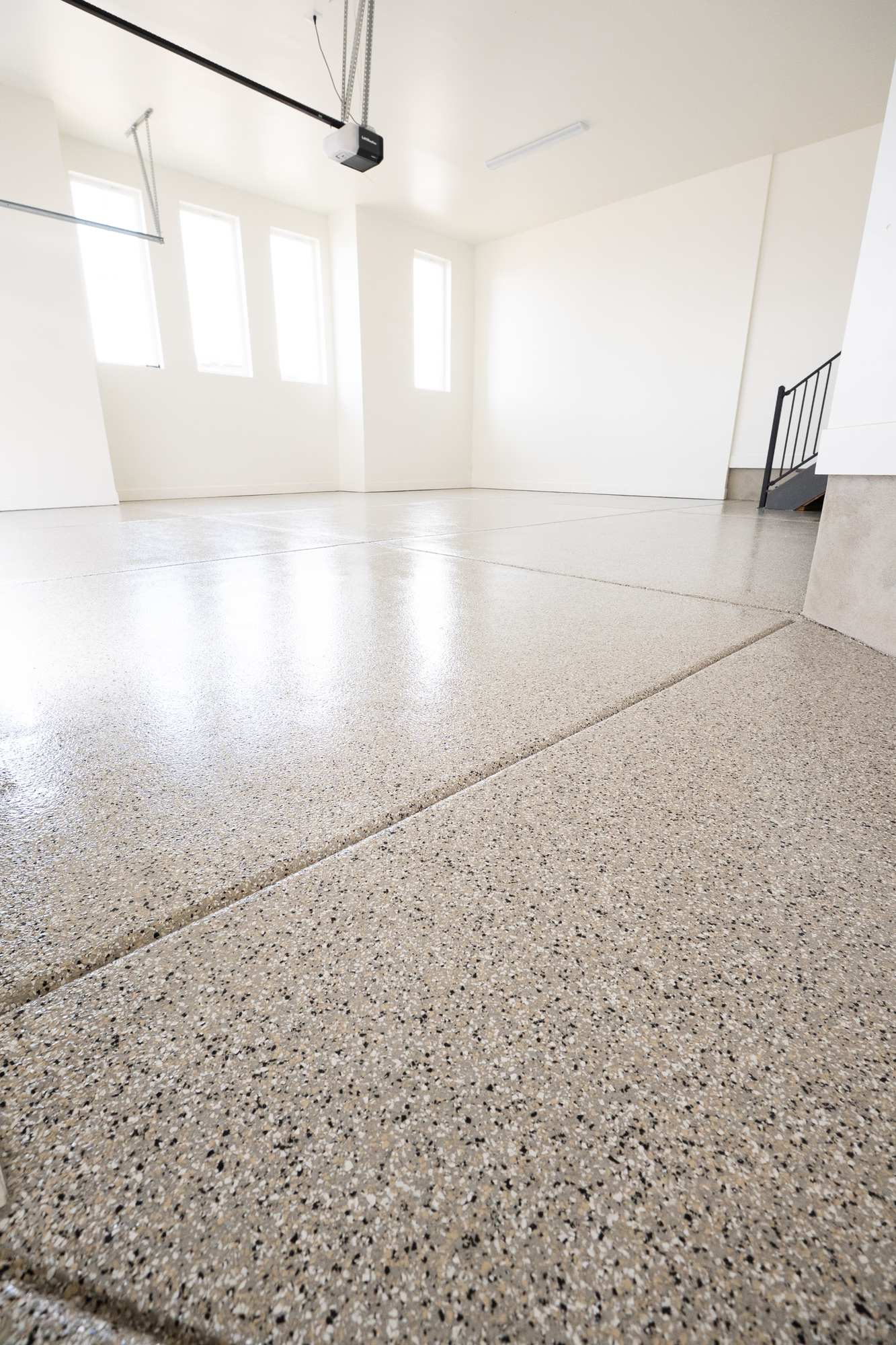 Residential tan flake epoxy garage floor by Lifetime Coatings in Utah