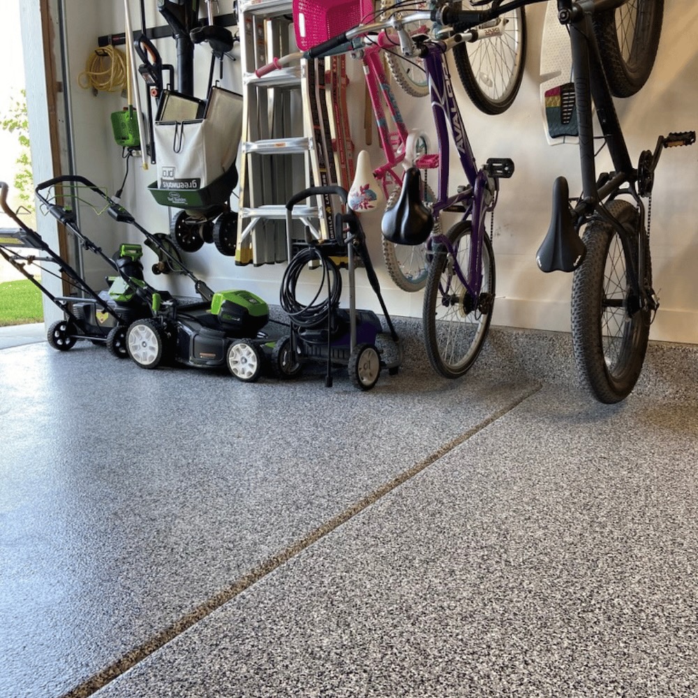 Residential white water flake epoxy garage floor by Lifetime Coatings in Utah