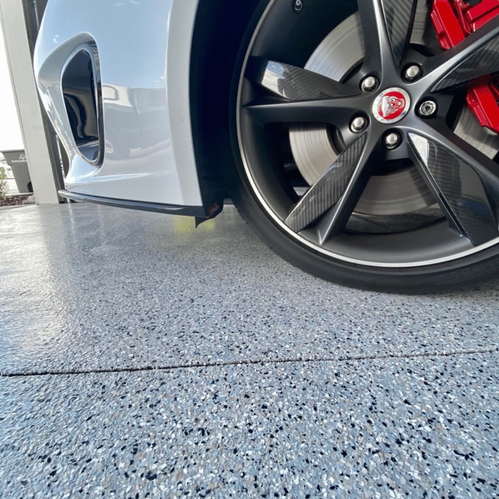 Residential white water flake epoxy garage floor by Lifetime Coatings in Utah