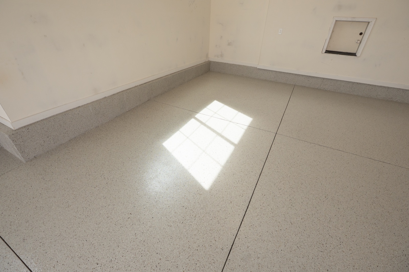 hybrid flake epoxy garage floor in Dune