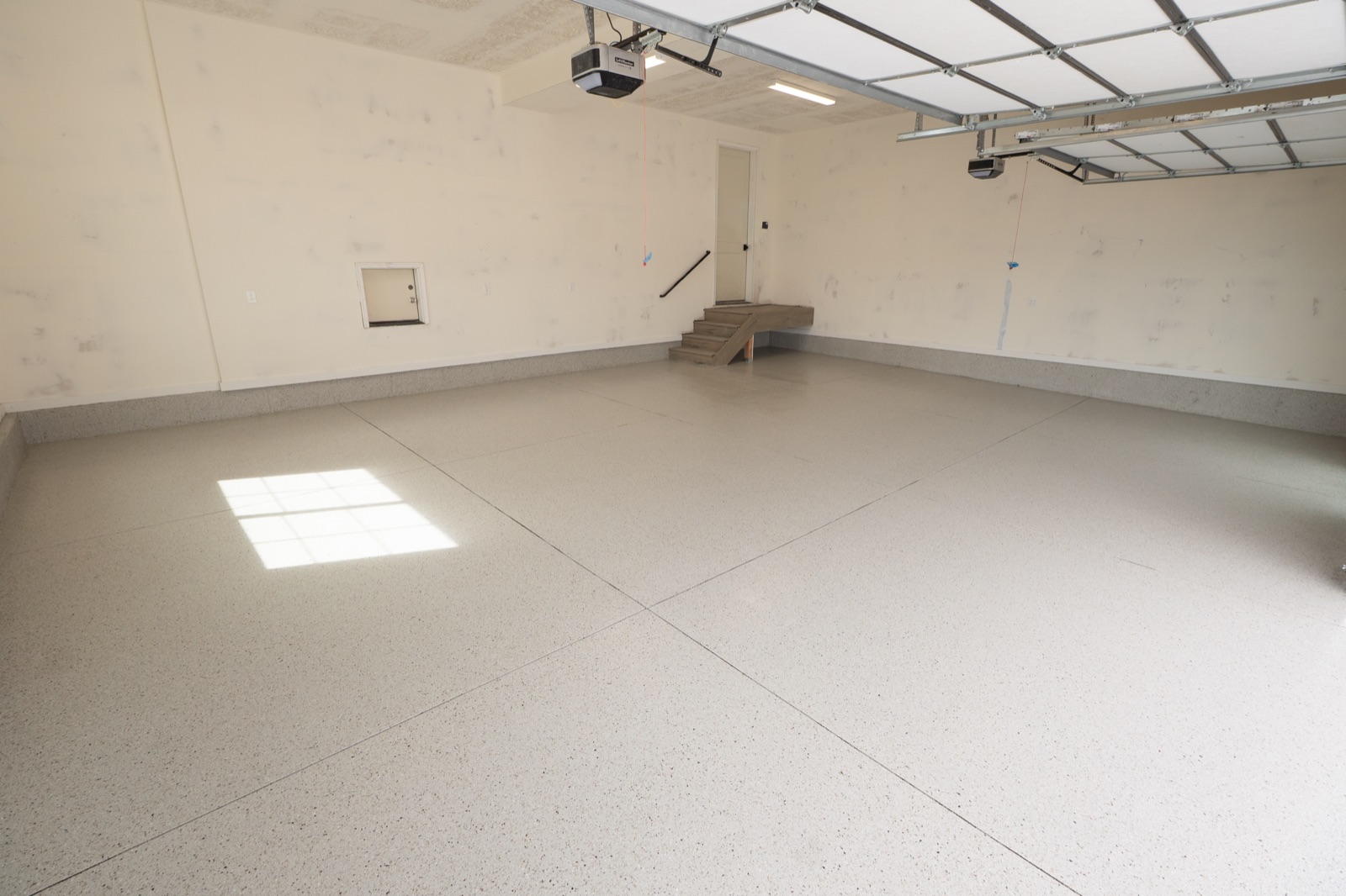 hybrid flake epoxy garage floor in Dune