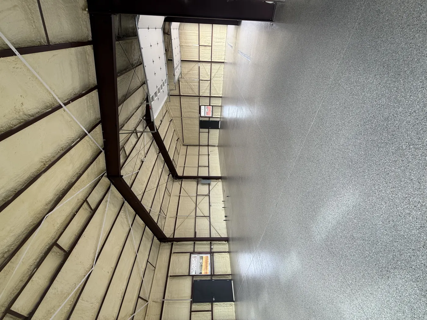 Riverbed flake epoxy garage floor by Lifetime Coatings