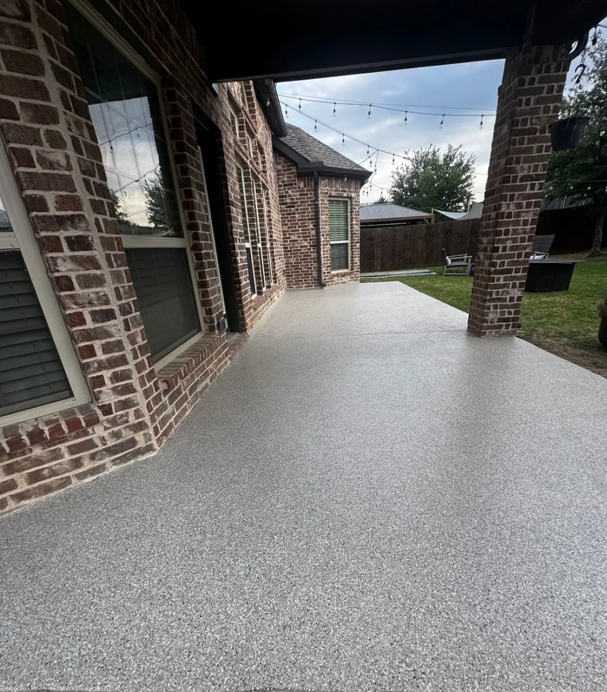 Riverbed flake epoxy garage floor by Lifetime Coatings