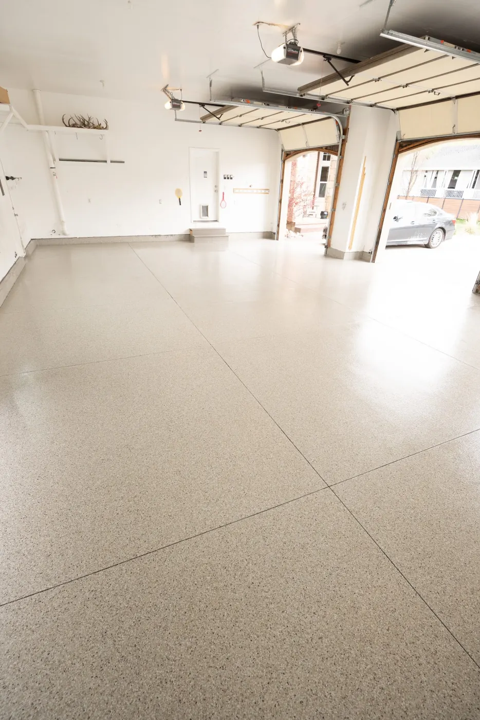 Riverbed flake epoxy garage floor by Lifetime Coatings