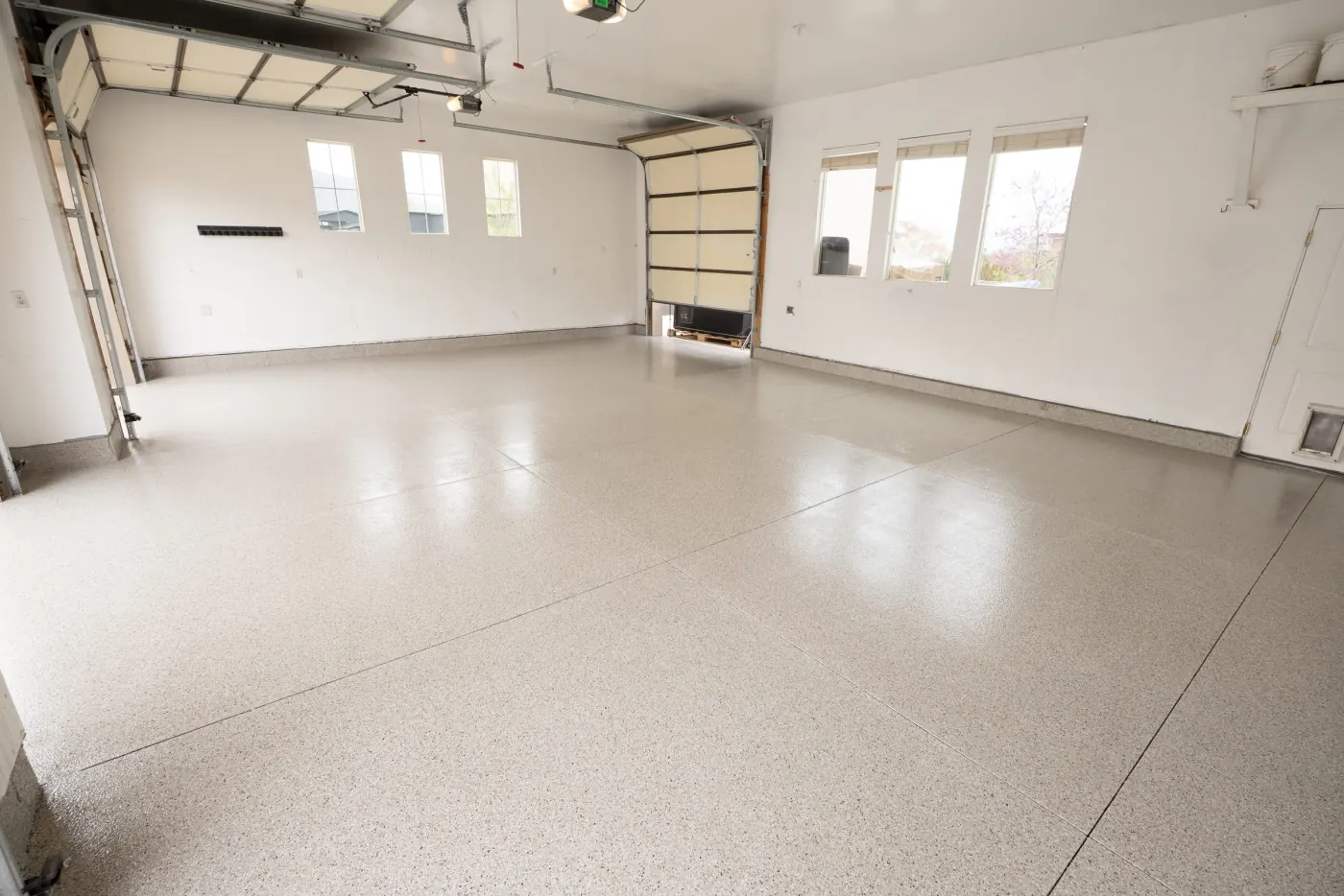 Riverbed flake epoxy garage floor by Lifetime Coatings