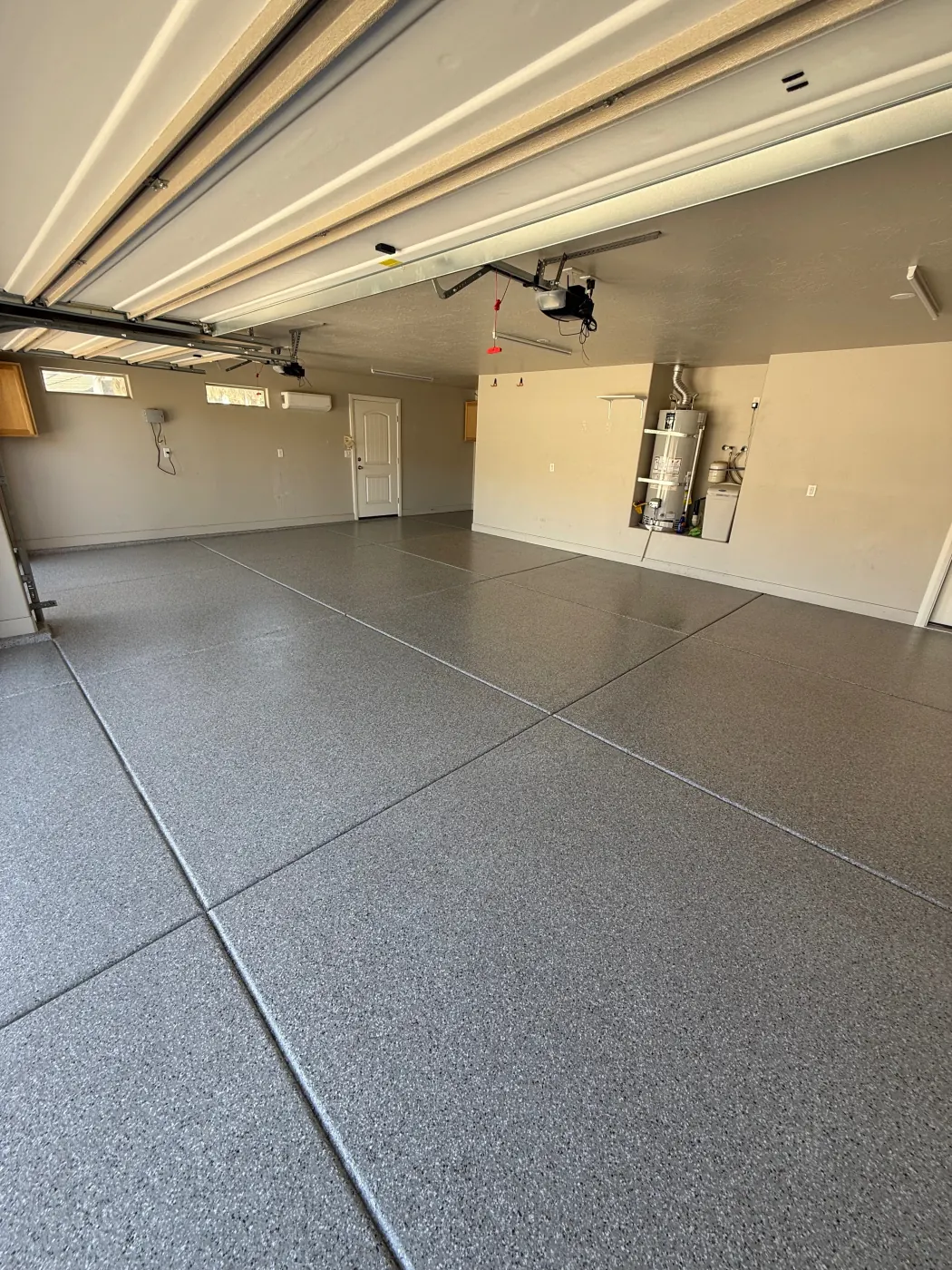 Riverbed flake epoxy garage floor by Lifetime Coatings