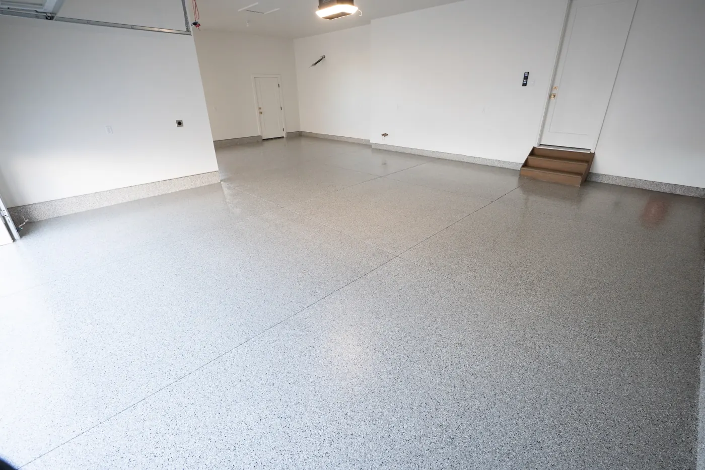 Fallout flake epoxy garage floor by Lifetime Coatings