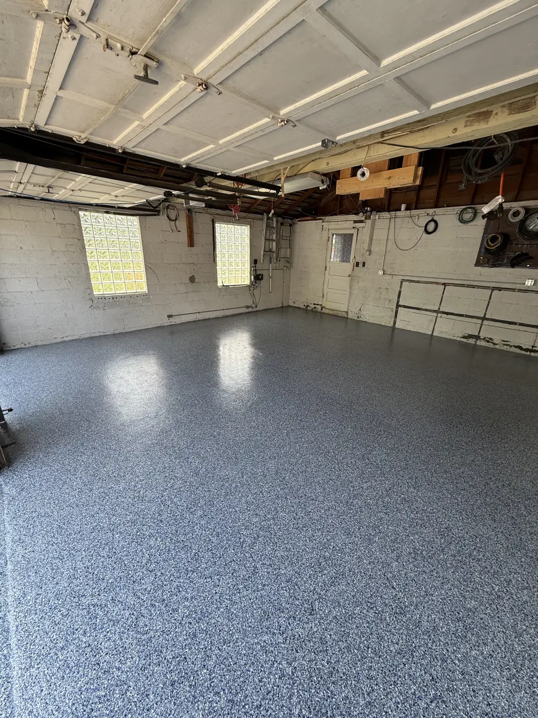 Nautical flake epoxy garage floor by Lifetime Coatings