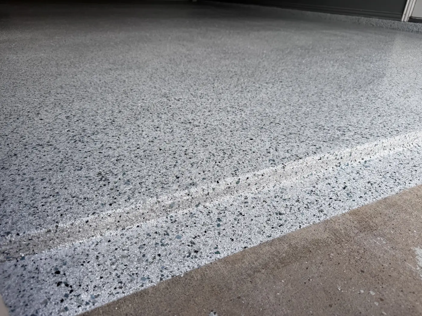 Glacier flake epoxy garage floor by Lifetime Coatings