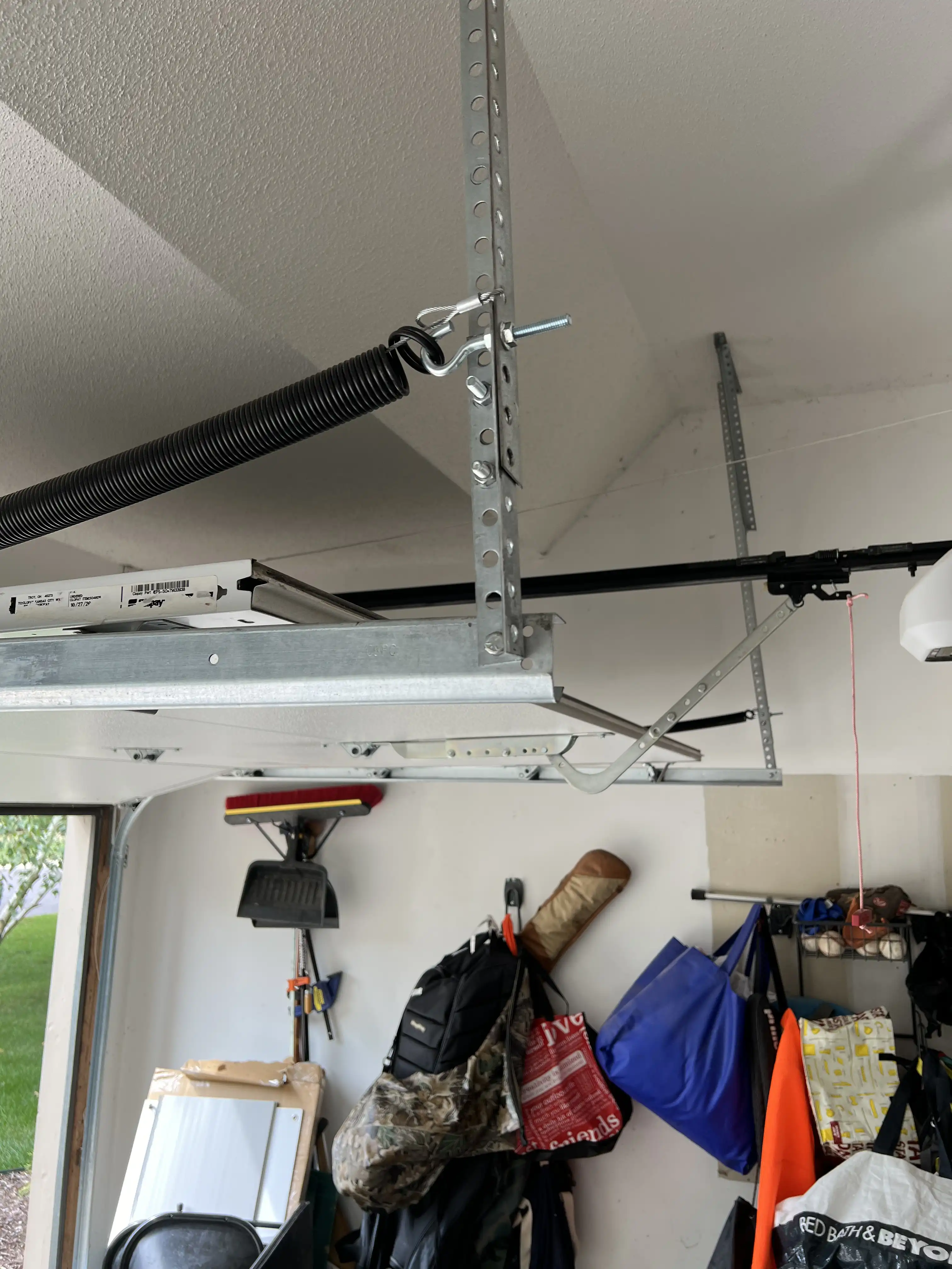 Repaired garage door hardware after a service call in Overland Park, KS