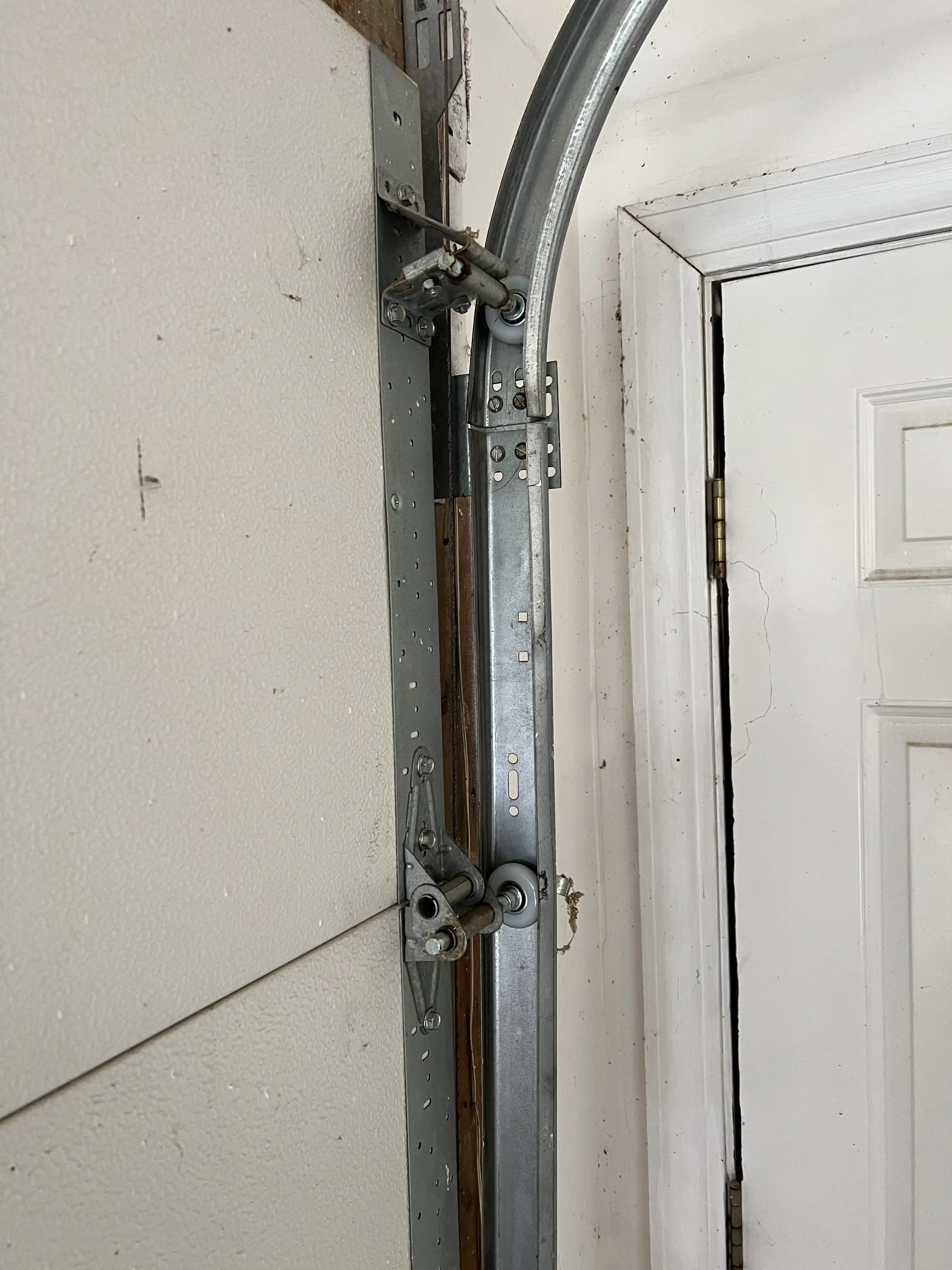 New garage door rollers after replacement in Louisburg, KS