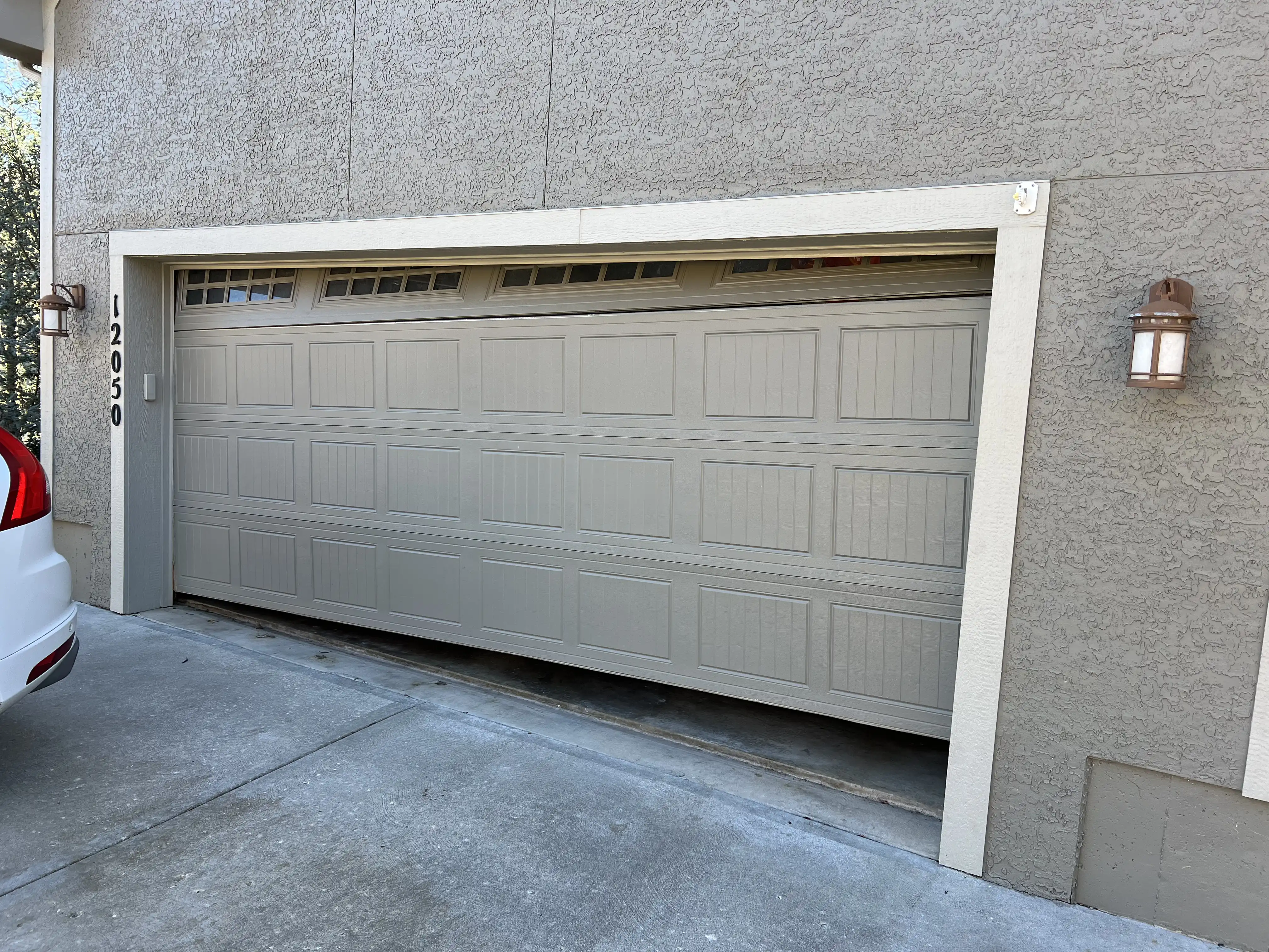 Snapped garage door torsion cable in Olathe, KS before replacement
