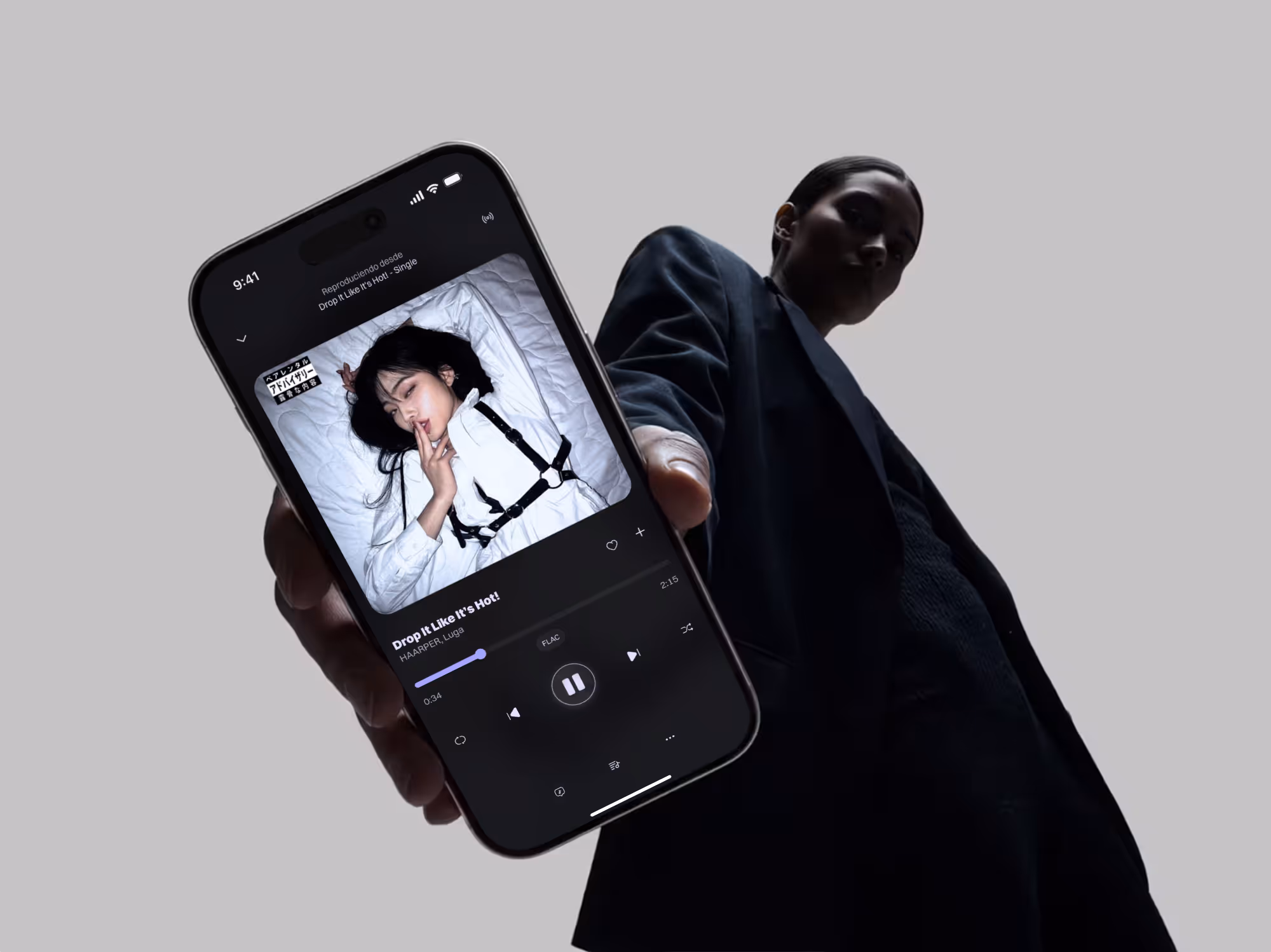 A mockup for the music app project, presenting a women holding her phone with the music player screen showed up