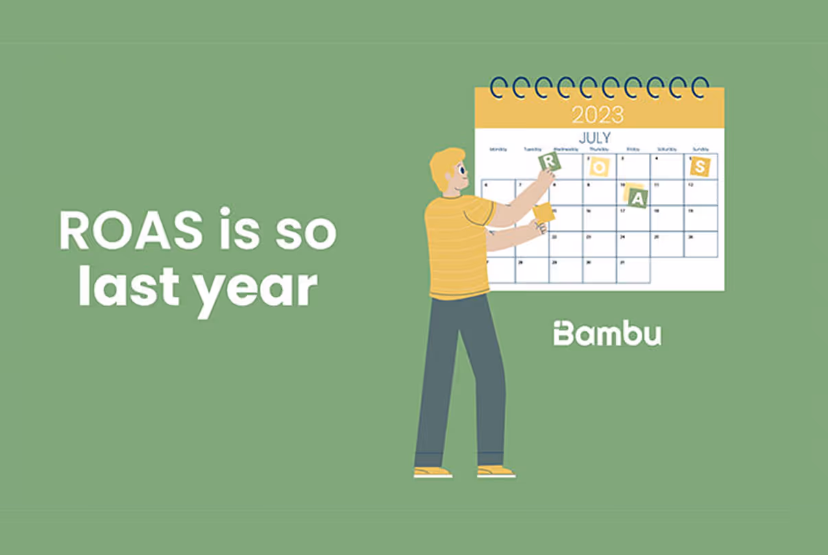 Illustration of a person placing letters spelling ROAS on a July 2023 calendar with the text 'ROAS is so last year' and the Bambu logo.