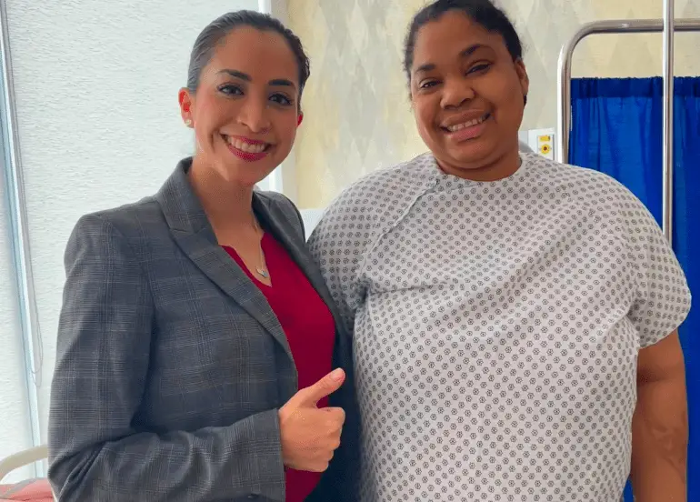 Dr. Sandy’s dedicated Surgical Concierge and a happy patient celebrating a successful bariatric procedure with a thumbs up in Tijuana.